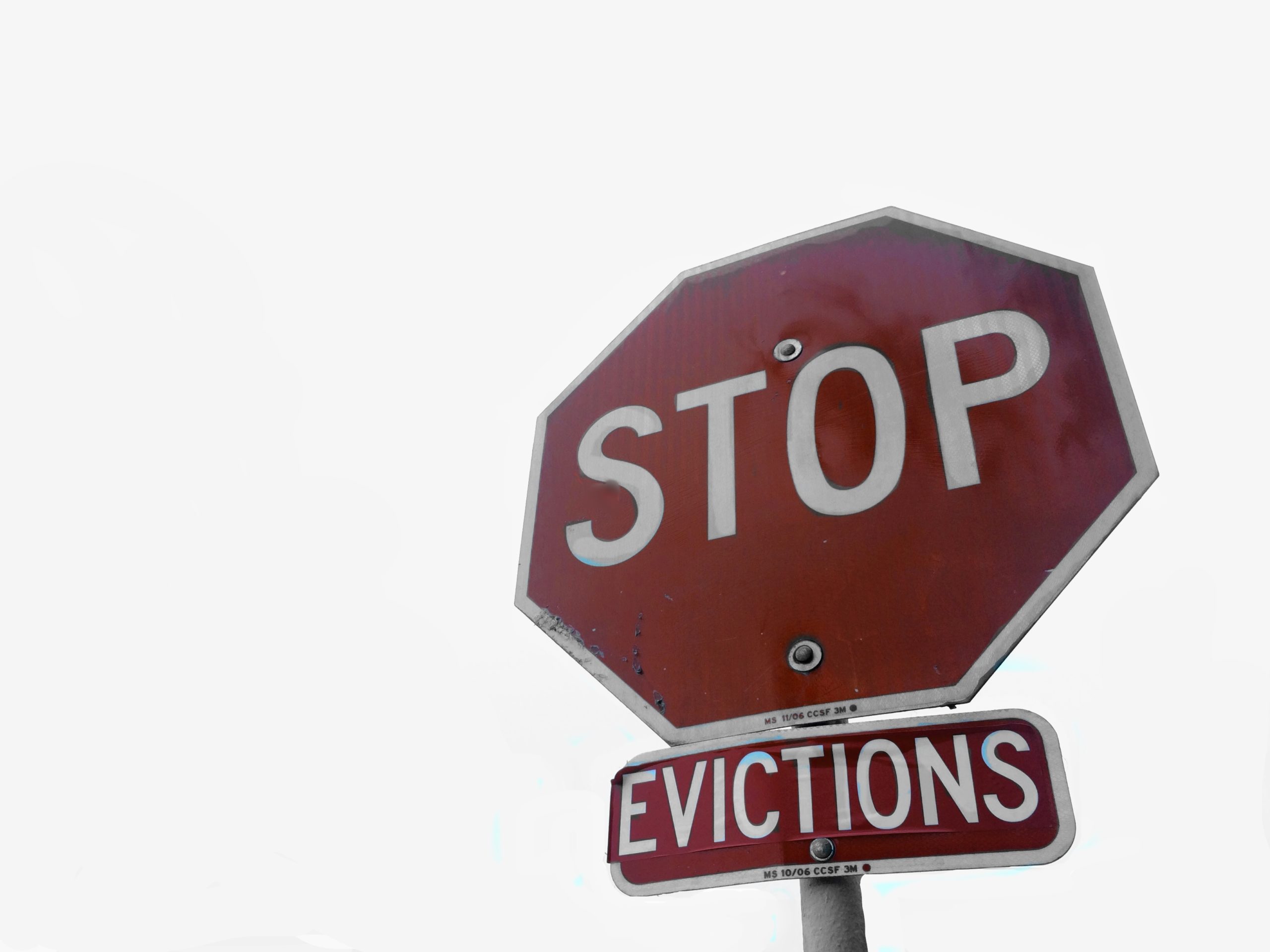 A stop sign with an added sign below it that reads "Colorado eviction," against a blank background, highlighting the ongoing rental crisis.