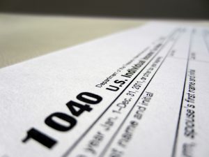 Close-up of a u.s. 1040 tax form including State Income Tax Refunds.
