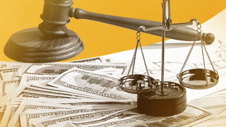 Balancing a budget illustrated with scale, dollar bills and paperwork.